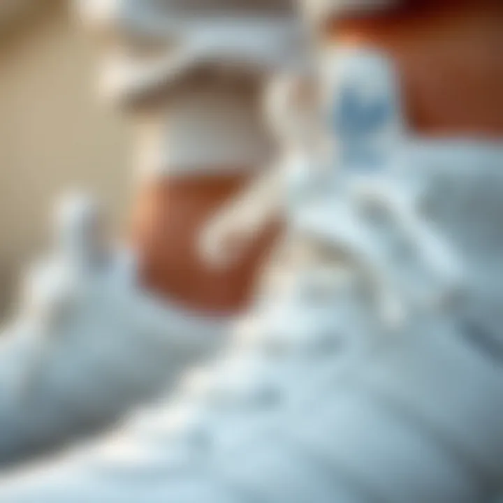 Close-up view highlighting the comfort features of Adidas white shoes