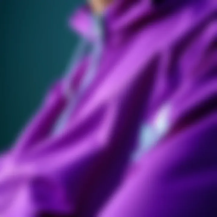 Close-up of the intricate design details and fabric of an Adidas purple jacket