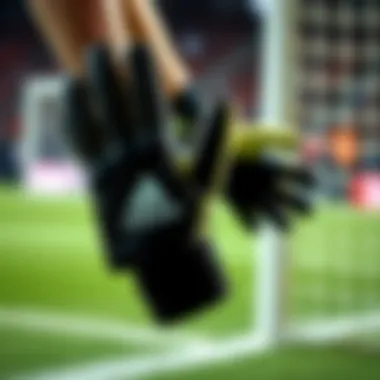 A pair of Adidas Predator gloves displayed in action during a soccer match.