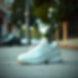 Elegant white New Balance sneakers on a stylish sidewalk