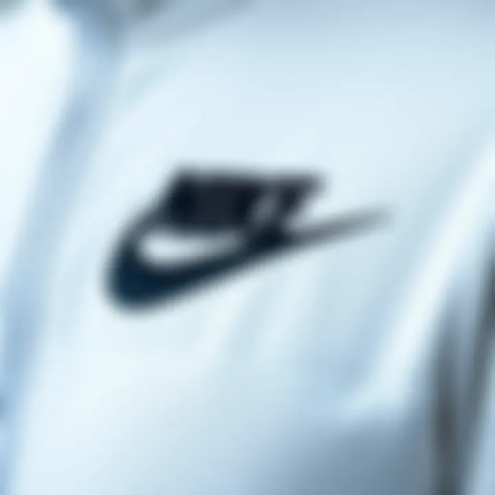 Brand Excellence of Nike White Tracksuit Close-up of Nike logo on white tracksuit, representing brand excellence