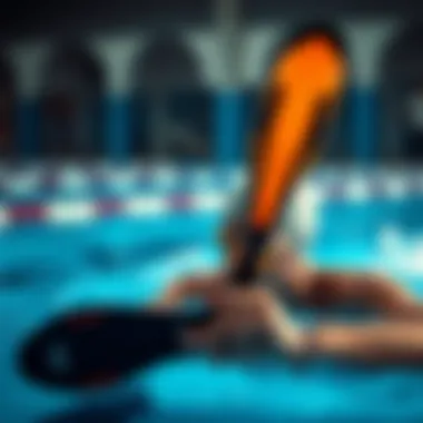 Focused swimmer training technique with fins in a pool