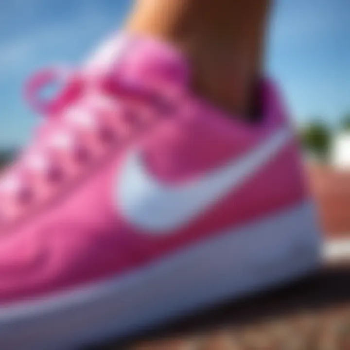Close-up of the unique design features of Pink Nike Court footwear