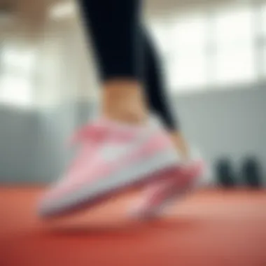 Pink Nike Court shoes in action during a workout