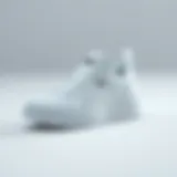 Stylish Puma white sneakers on a minimalist background