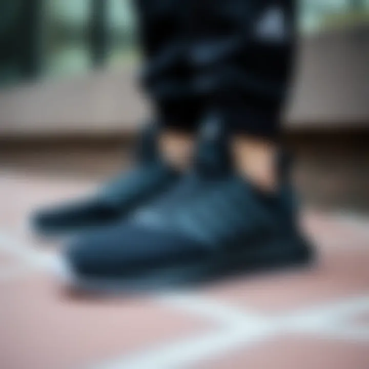 Sleek design of black Adidas athletic footwear