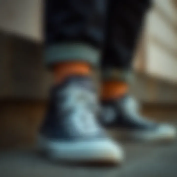 Close-up of black Converse shoes paired with casual outfit