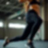 Dynamic pose showcasing athletic leggings in a fitness setting