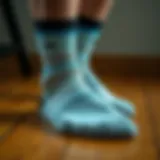 Stylish sports socks on a wooden surface