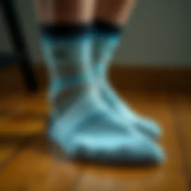 Stylish sports socks on a wooden surface